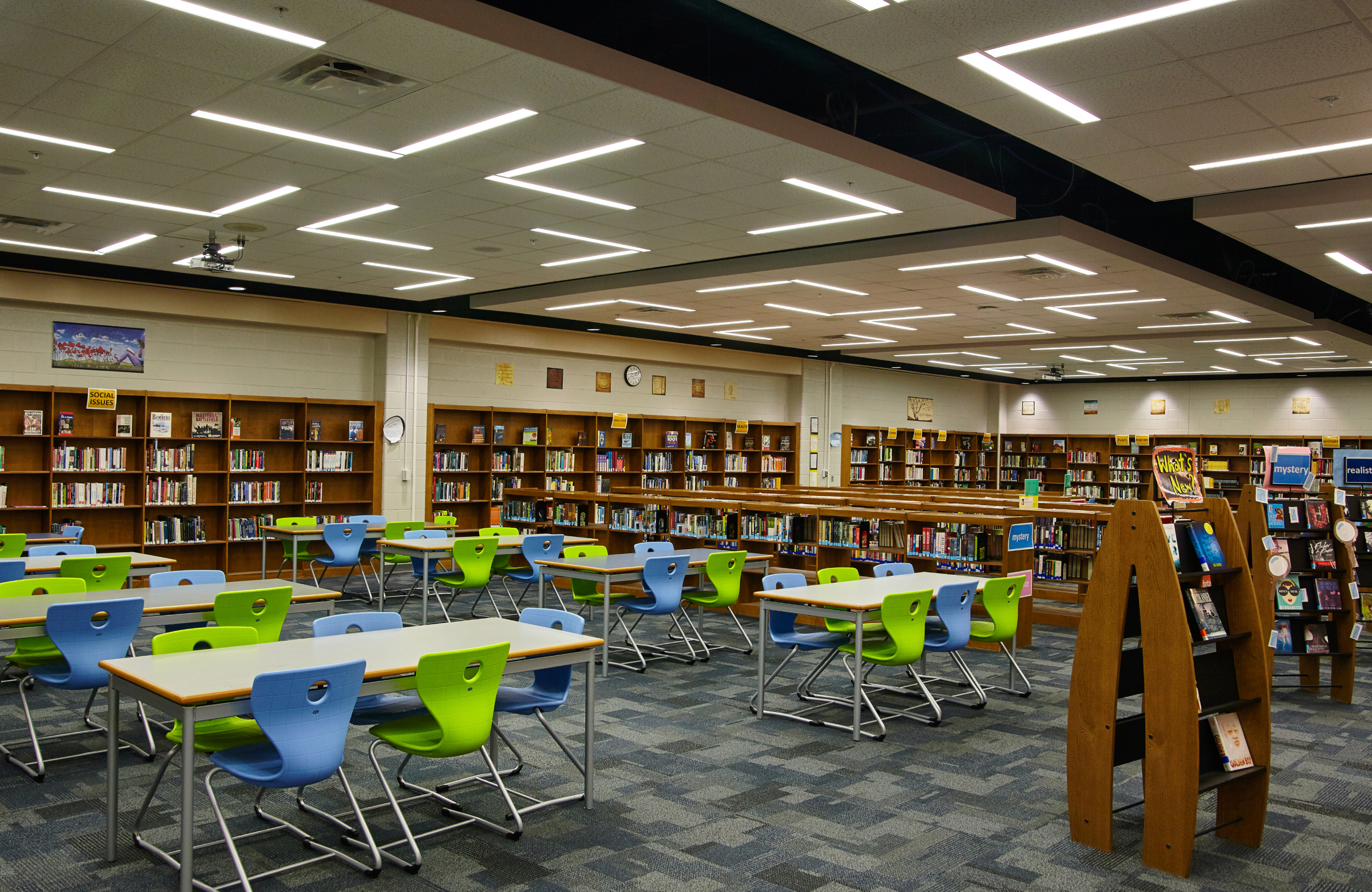 Contemporary university library interior design with digital learning and study zones