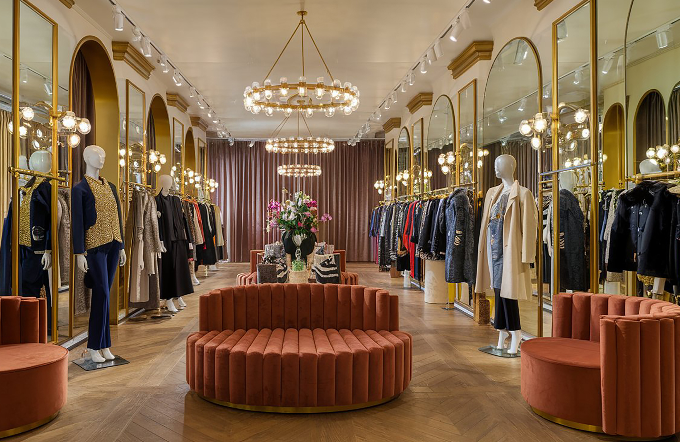 Luxury commercial boutique interior with elegant displays, statement lighting, custom furnishings, and sophisticated detailing.