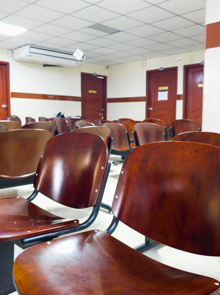 Government office meeting area with professional seating, presentation facilities, and an organised workspace environment.