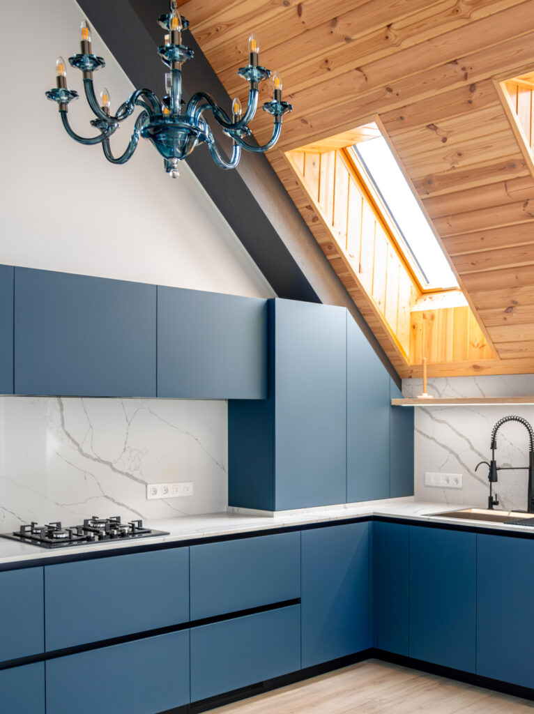 Modern blue modular kitchen with sleek cabinets, open shelving, integrated lighting, and contemporary kitchen detailing.