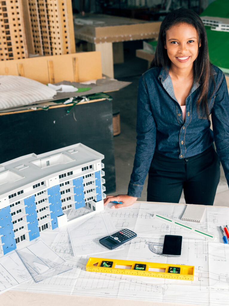 Real estate professional presenting property information in a modern office designed for client interactions.
